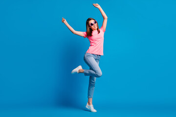 Fototapeta na wymiar Full length body size photo of cheerful happy girl dancing at disco party in summer party isolated on vivid blue color background