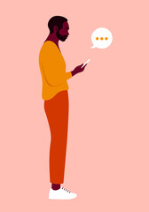 An African man is standing in profile and holding a smartphone. Figure of person in a full-length. Vector flat Illustration