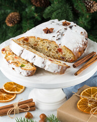Christmas stollen on wooden background. Traditional Christmas festive pastry dessert. Stollen for Christmas.