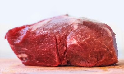 a piece of beef meat on a cutting Board