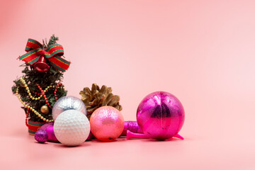 Golf ball with Christmas ornament decoration 