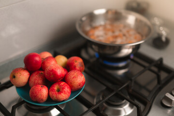 The process of preparing jam from red apples