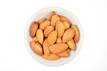 Top view of almond in bowl isolated on white background with clipping path