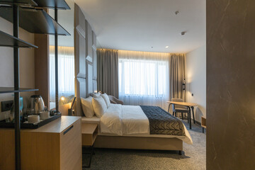 Interior of a luxury master bed hotel bedroom
