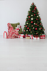 beautiful Christmas tree with gifts decor new year and terrier white room
