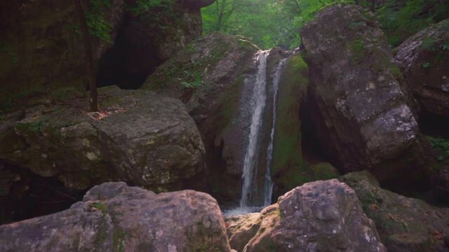Forest Waterfall On Rocky Gorge - Soteska Pekel In Slovenia - panning down shot