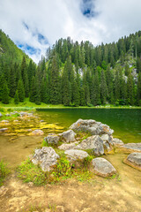 Obraz premium Planina pri jezeru lake with surrounding mountains in Triglav national park, Slovenia