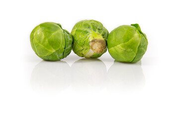 Brussels sprout isolated on white background. Still-life picture of green cabbages taken in studio with soft-box.