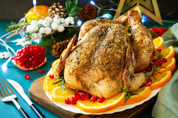Christmas dinner, winter Holiday table. Baked turkey with spice.