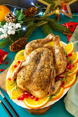 Christmas dinner, winter Holiday table. Baked turkey with spice.