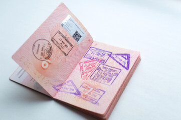 Russian passport stamped on border crossing. Departure and arrival immigration stamps.