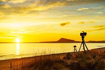 Camera take photo from sunrise over sea