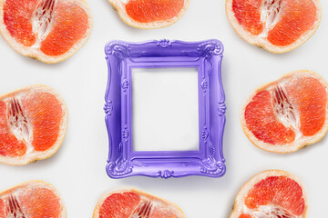 Photo frame with copy space decorated grapefruit. Mockup concept