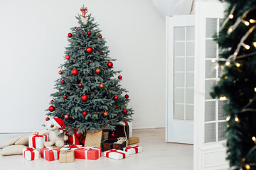 Red decor new year interior Christmas tree with gifts