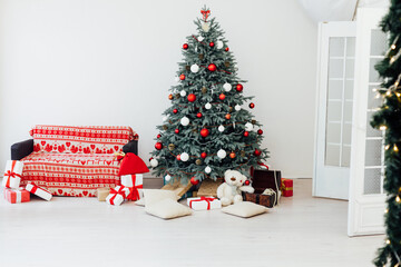 Red decor new year interior Christmas tree with gifts