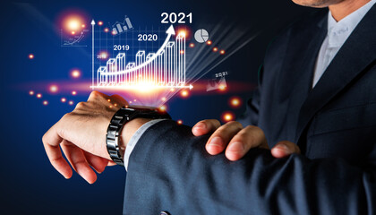 Businessman use watch virtual digital reality for monitoring trend market year 2021, Digital technology marketing concepts.