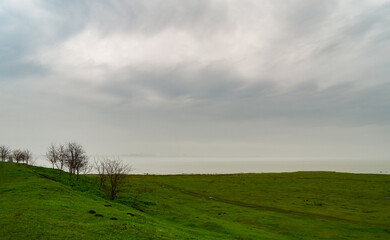 The far bank of the river is lost in the fog