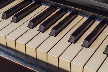 Closeup of old piano keyboard