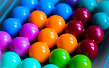 Children's puzzle. Bright colored balls. They lie next to each other.