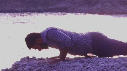 Indian men push-up outdoor without equipment,Young indian doing push ups on ocean beach,doing push up near the lake,Man exercising with push ups outdoor