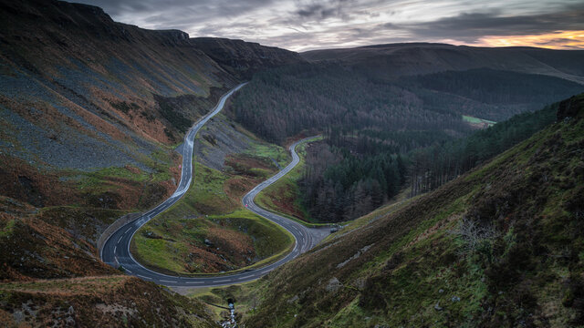 A hairpin bend in a steep mountain road. The road is located in the lower Brecon Beacons, south Wales.