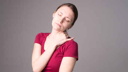 Tired woman feeling pain, massaging tense muscles