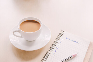 Fototapeta na wymiar cup of coffee and notebook