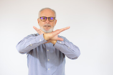 Grey haired senior man wearing casual shirt and glasses over white background Rejection expression...