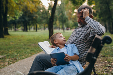 grandfather and grandson spending time together in public park