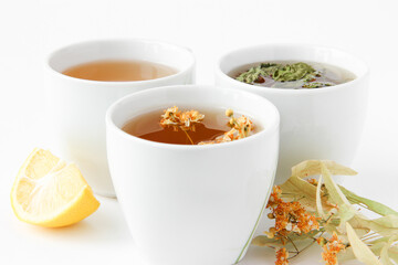 Additional treatment. Cups with natural tea. Tea with lemon, mint and lime.