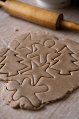 Christmas and New Year holidays, family celebration traditions. Mother cooking festive homemade sweets.