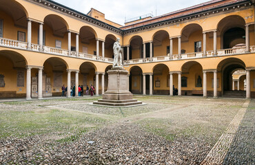 Fototapeta premium The Statue and courtyard of Alessandro Volta in the University of Pavia, Lombardy, Italy