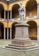 Fototapeta na wymiar The Statue in courtyard of Alessandro Volta in the University of Pavia, Lombardy, Italy