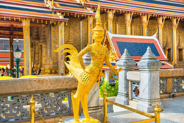 Gold statue of Kinnari, mythical creature half human half bird, at Temple of Emerald Buddha, Grand...