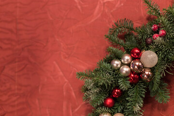 Christmas composition of fir branches, red apple, cotton flowers and red berries and a decorative eucalyptus branch. Gift box for home decoration before the New Year.