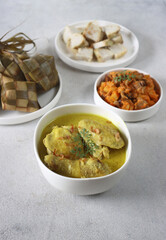 Ketupat Lebaran. Traditional celebratory dish of rice cake with several side dishes, popularly served during Eid celebrations.