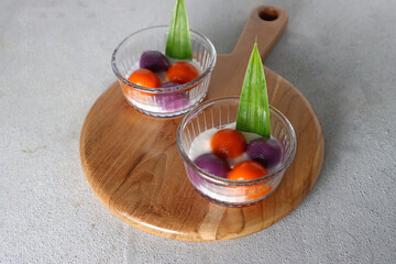 Putri mandi, Indonesian traditional dessert made from sweet potato glutinous rice balls, served with coconut milk. An Indonesian typical refreshment and dessert during Ramadan month.