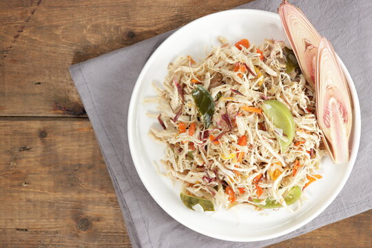 Ayam suir Kecombrang : shredded chicken spicy with kecombrang or honje or kincung fragrant edible flower. Selective focus