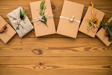 Gift boxes zero waste and paper recyclable eco packaging, for various holidays, Christmas, Valentine's Day, on a wooden background. Zero waste concept, environmental protection.Flat lay.Copy space