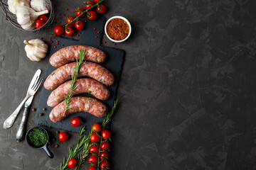 raw sausages with ingredients  in a black background with copy space for text - 396757109