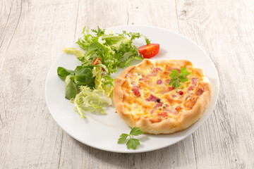 quiche and salad in plate