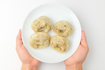 Dumplings with meat on a white background