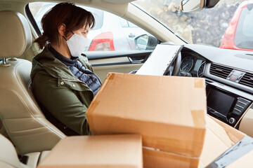 Fototapeta premium Subcontractors as parcel deliveries with parcels in the car