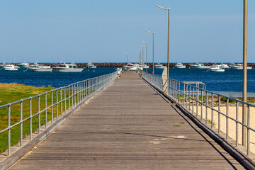 Naklejka premium The Port MacDonnell jetty with commercial fishing boats in the background taken in South Australia on November 10th 2020