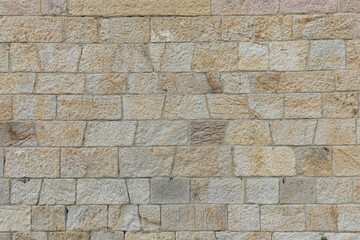 Beautiful new stone wall with colorful bricks very clean and even with space for texture background