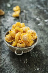 Raw Uncooked Cappelletti with flour