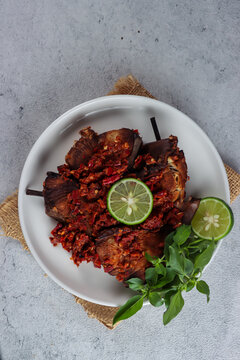 Sambal or penyet Ikan panggang or ikan manyung asap is ariidae fish preserved by fumigation sauce. Smoked ariidae fish sell in the traditional market in Indonesia.
