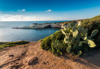 Limestone rock with arch, S'`Archittu di Santa Caterina in Oristano Province, Sardinia, Italy