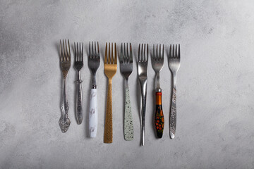 Many different forks on a light background