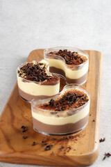 Tiramisu dan kopi mouse, Tiramisu and coffee mousse in glass, topping with chocolate, traditional Italian dessert made of mascarpone.